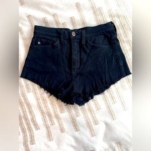 Two high waisted jean shorts with small fringe bottoms. Black and whit combo!